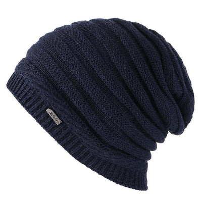 Fashionable dark navy slouchy beanie from BONEHEAD PRO-CREATIONS, versatile for warmth and style.