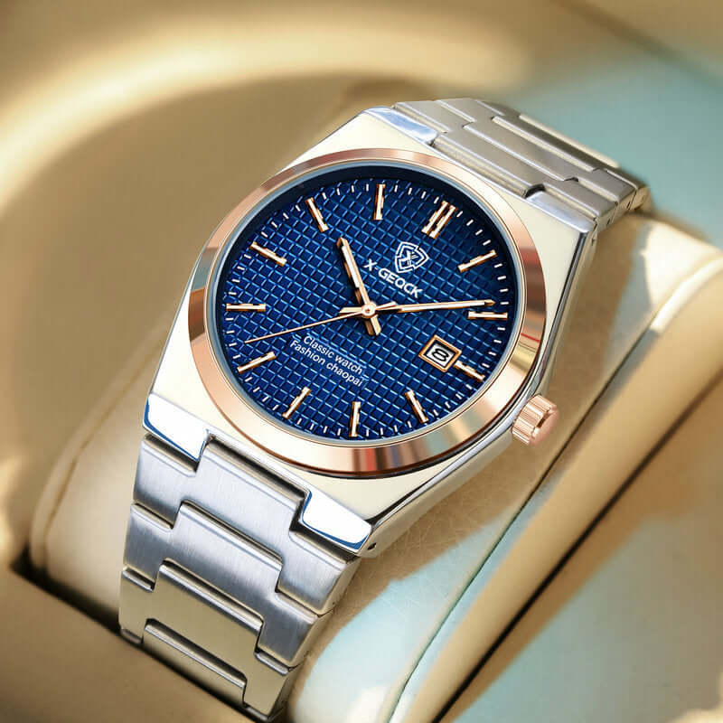 Men's quartz watch with blue face and gold accents on a stainless steel strap, perfect for business or casual wear.