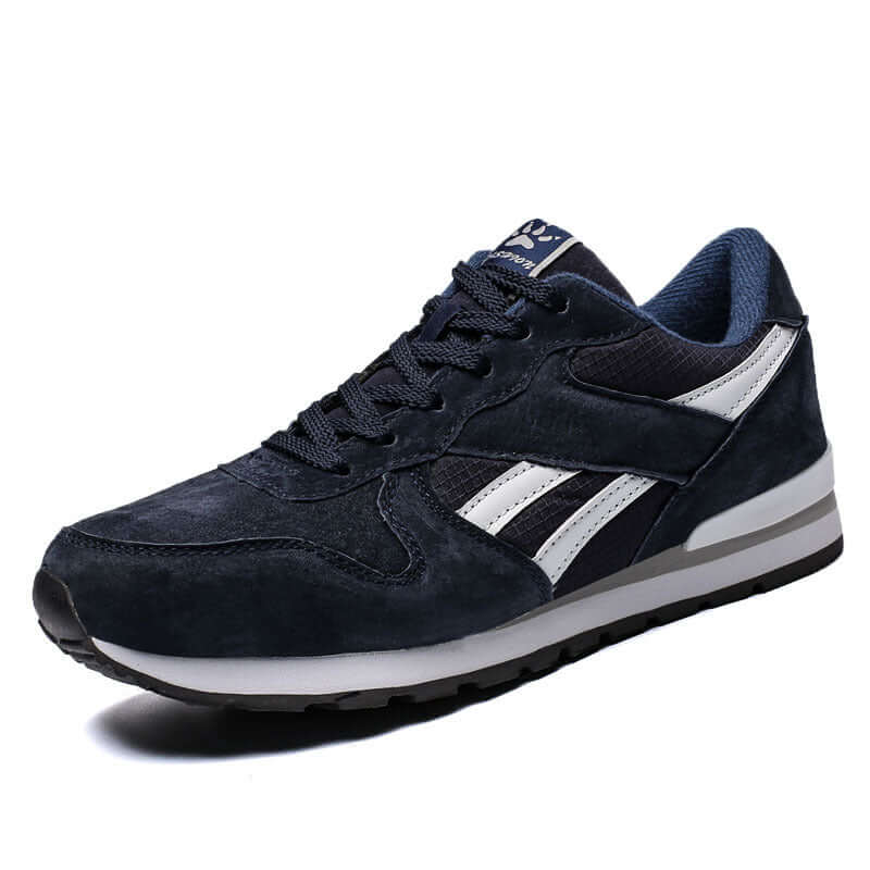 Dark blue casual running shoes for men with white accents, low upper, and rubber sole by BONEHEAD PRO-CREATIONS.