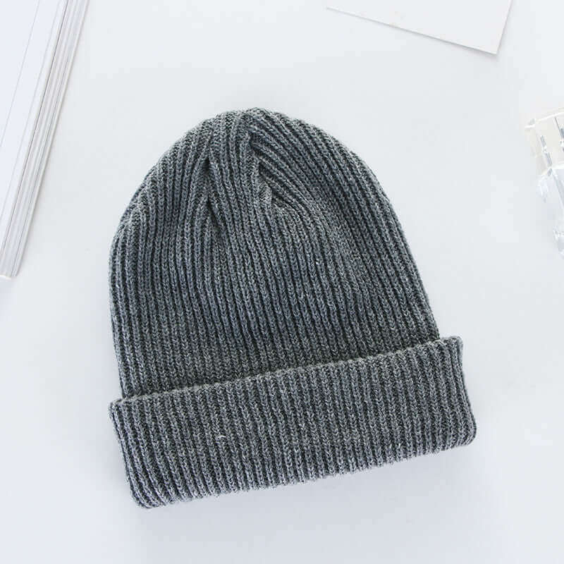 Men's and women's curling fashion hat by BONEHEAD PRO-CREATIONS, grey knit cap made of wool.