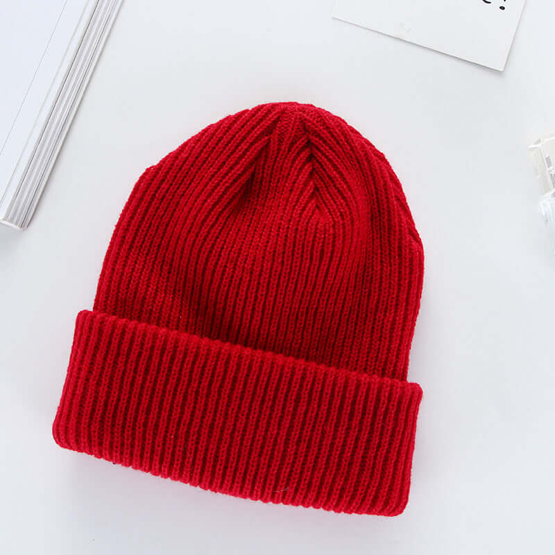 Red knit cap made from wool, perfect for curling fashion. BONEHEAD PRO-CREATIONS stylish unisex hat.