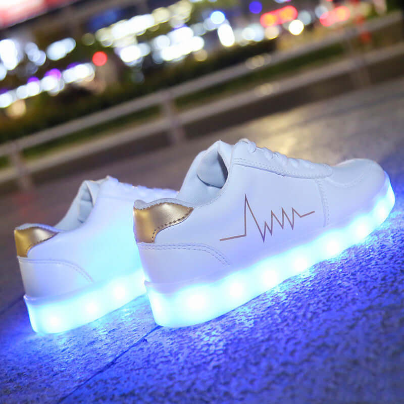 Luminous women's shoes with USB charging, featuring LED lights, stylish low-top design by BONEHEAD PRO-CREATIONS.