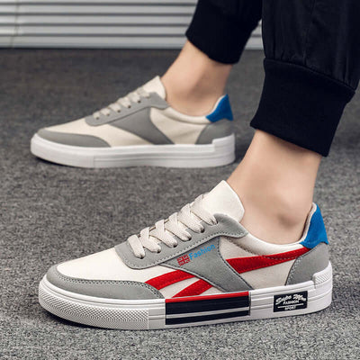 Men's casual canvas sneakers in beige with red and blue accents, perfect for stylish everyday wear by BONEHEAD PRO-CREATIONS.