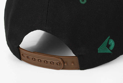 Close-up of the adjustable strap on a Simple Green Maple Leaf Hemp Leaf cap by BONEHEAD PRO-CREATIONS, showcasing the black fabric.