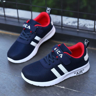 Children's navy sports shoes with red accents, featuring a breathable design and 'AIR' label, ideal for active play.