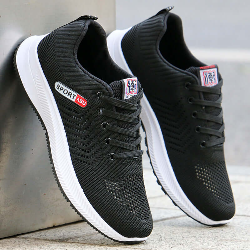 Breathable black mesh casual sports shoes with lace-up design and rubber sole for non-slip running and daily wear.