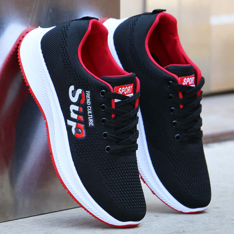 Breathable mesh casual sports shoes in black and red with lace-up design and flat heel by BONEHEAD PRO-CREATIONS.