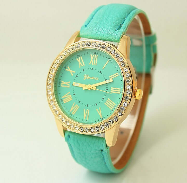 Women's Geneva quartz wrist watch with aqua leather band, Roman numerals, and rhinestone bezel from BONEHEAD PRO-CREATIONS.