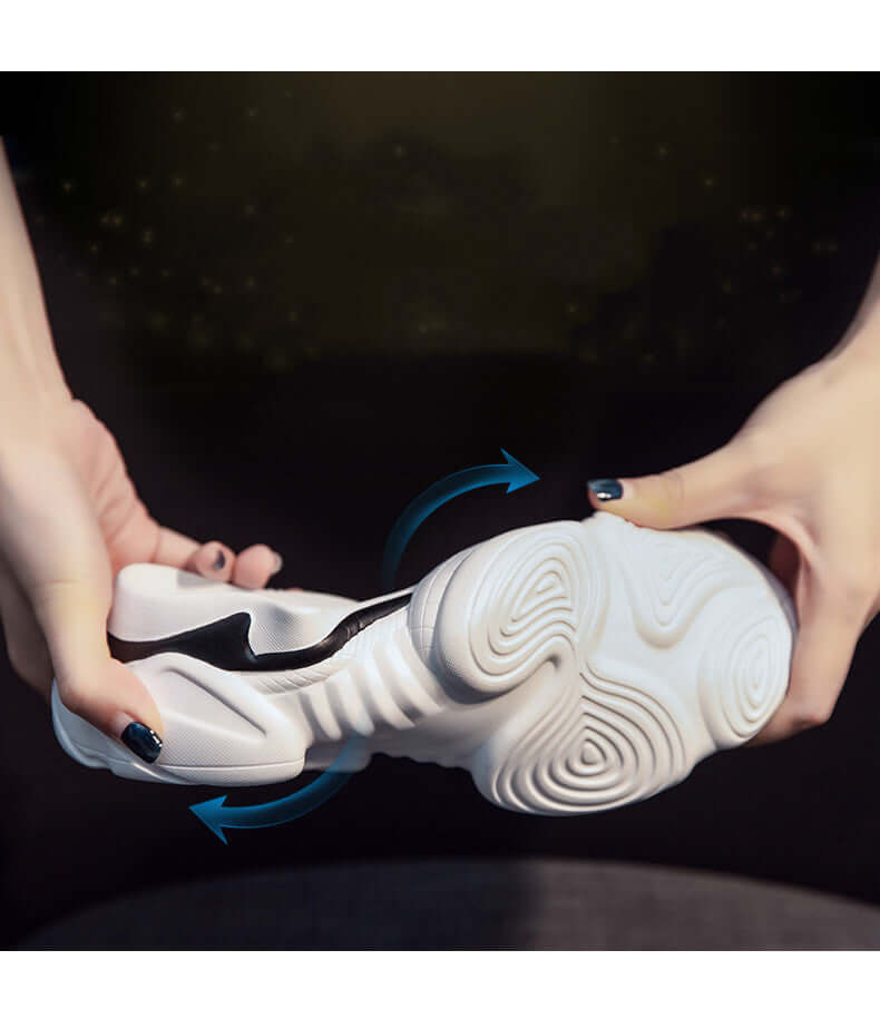 Hands demonstrating the flexibility of BONEHEAD PRO-CREATIONS breathable panda platform shoes sole.
