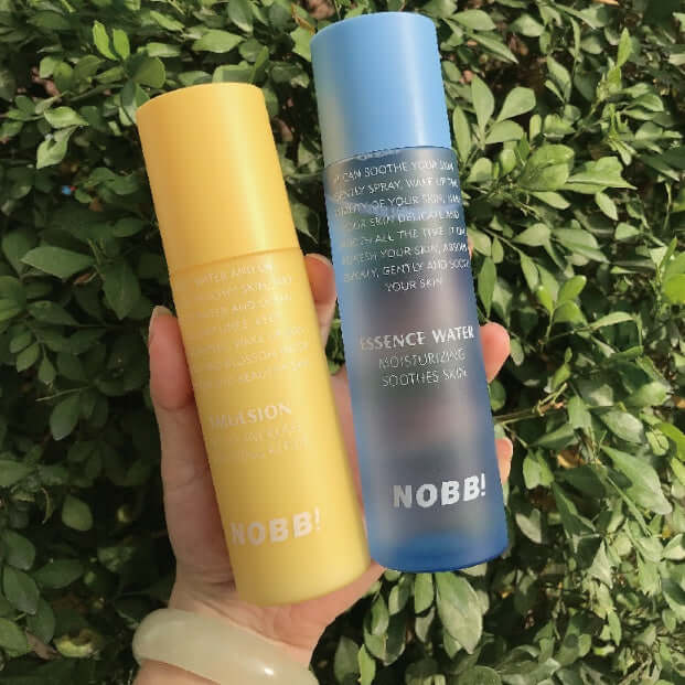 Moisturizing water with essence water and milk in yellow and blue bottles, perfect for hydration and skin soothing.