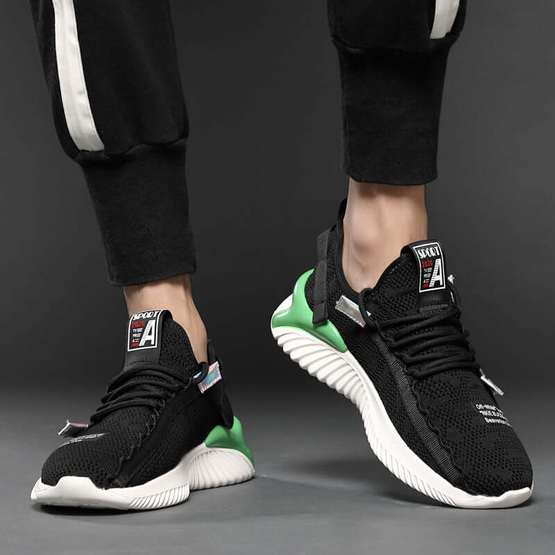 Trendy black breathable shoes with green accents, perfect for casual wear and comfort, designed by BONEHEAD PRO-CREATIONS.