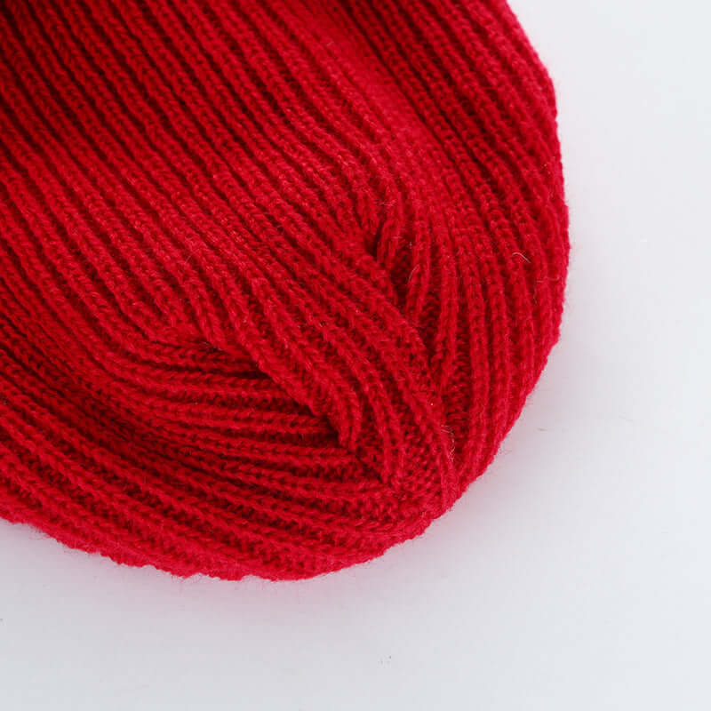 Close-up of a stylish red knit cap made from wool by BONEHEAD PRO-CREATIONS, perfect for men's and women's fashion.