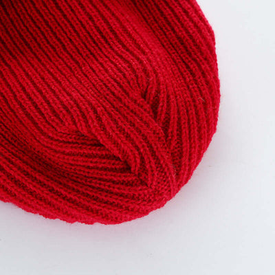 Close-up of a stylish red knit cap made from wool by BONEHEAD PRO-CREATIONS, perfect for men's and women's fashion.