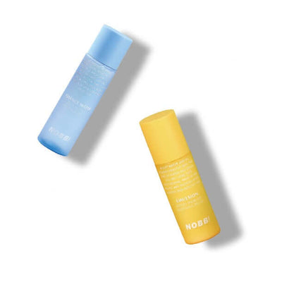 Two bottles of moisturizing water, one blue and one yellow, showcasing hydrating essence and milk for skin care.