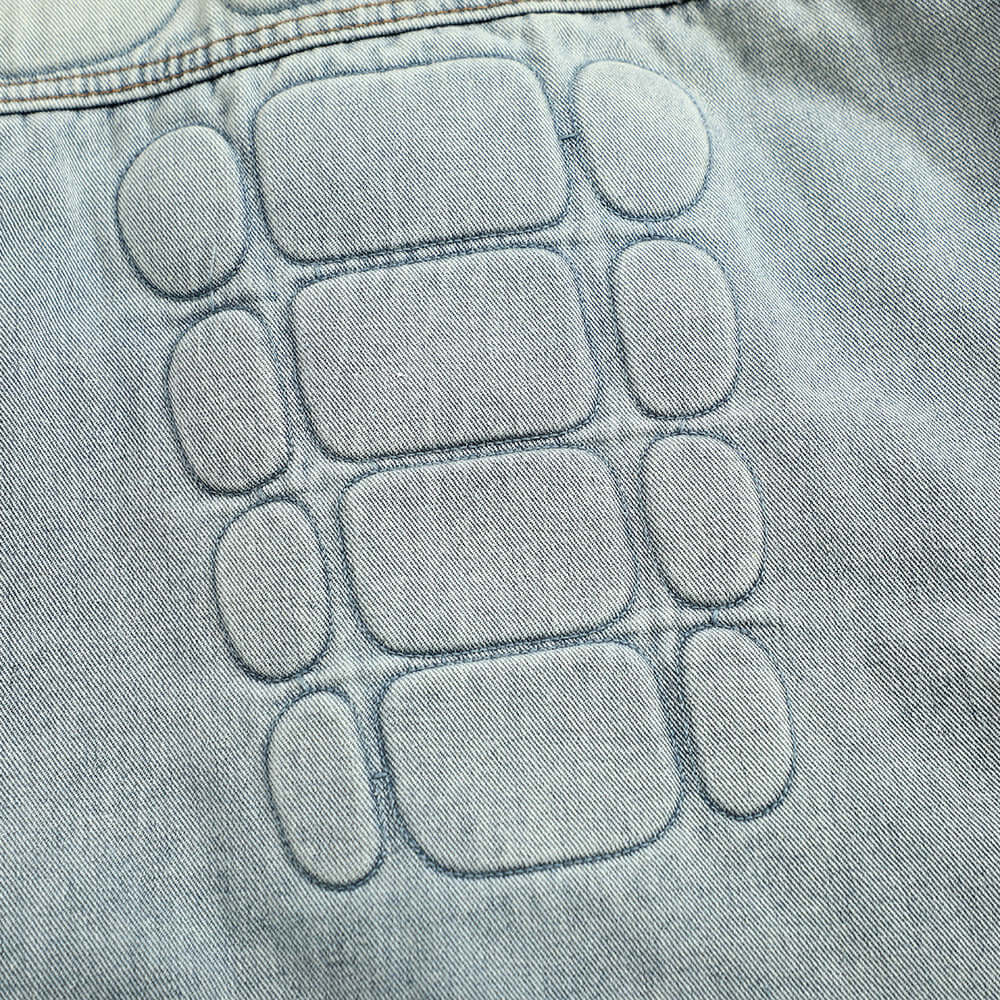 Punk-style skull graphic denim coat