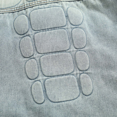 Punk-style skull graphic denim coat