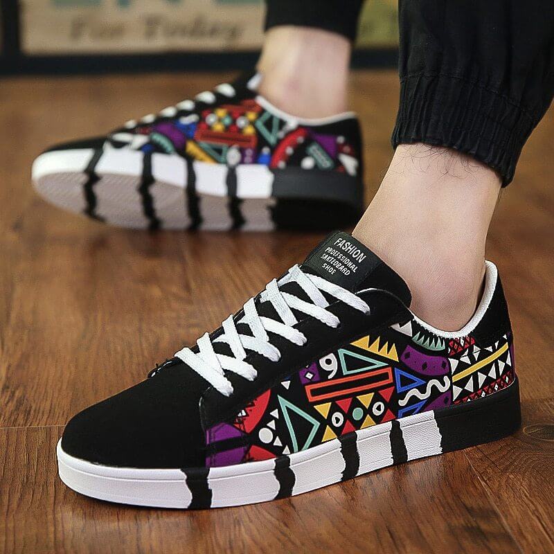 Trendy black canvas shoes with colorful geometric patterns, perfect for casual wear in any season.