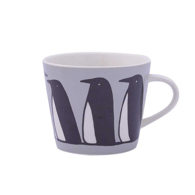Cute ceramic coffee mug featuring penguin illustrations, perfect for casual dining or gifting.
