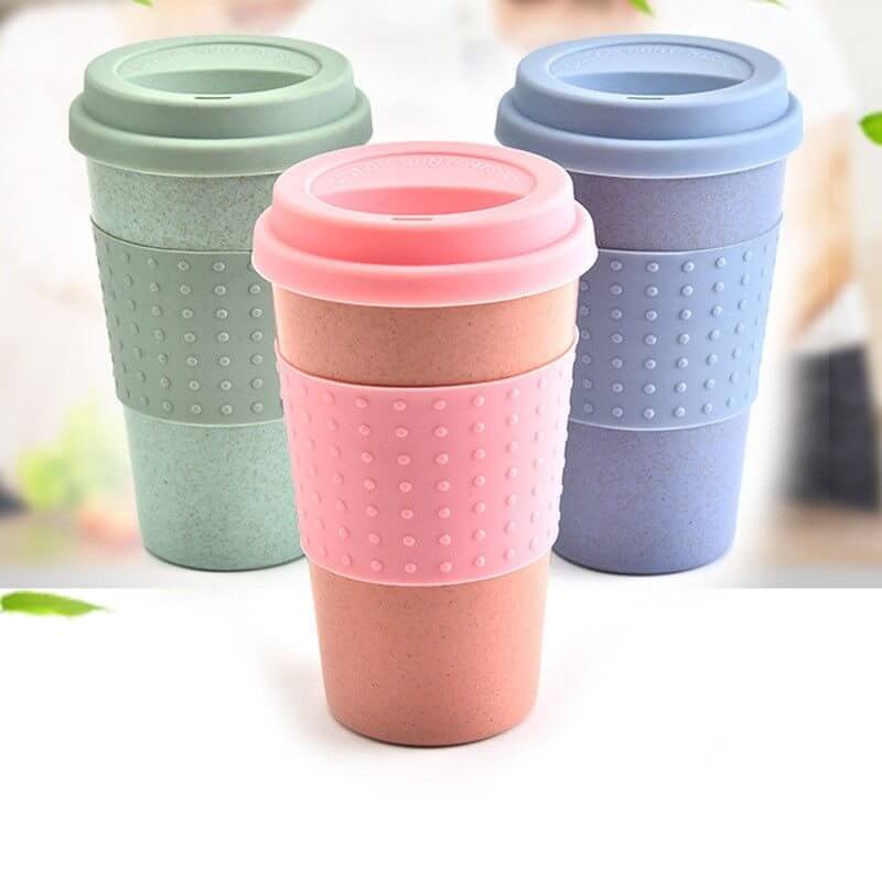 Three eco-friendly wheat straw water cups in pink, green, and blue, perfect for coffee and tea. Biodegradable and stylish.
