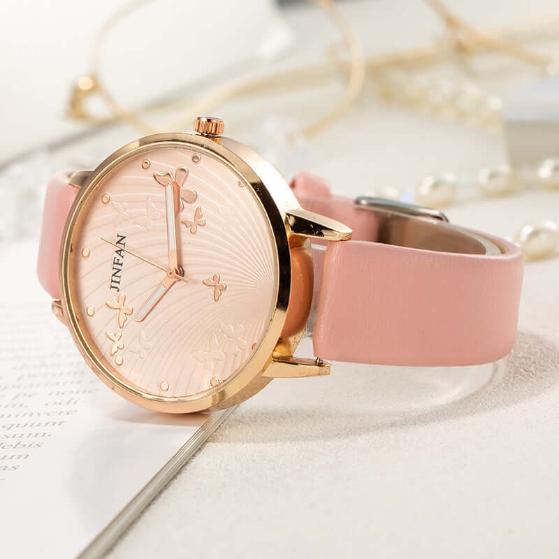 Casual student sweet butterfly wrist watch by BONEHEAD PRO-CREATIONS with pink imitation leather strap and stylish floral dial.