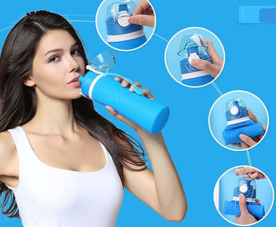 Woman using a blue silicone folding water bottle; portable, food-grade, collapsible design for travel.
