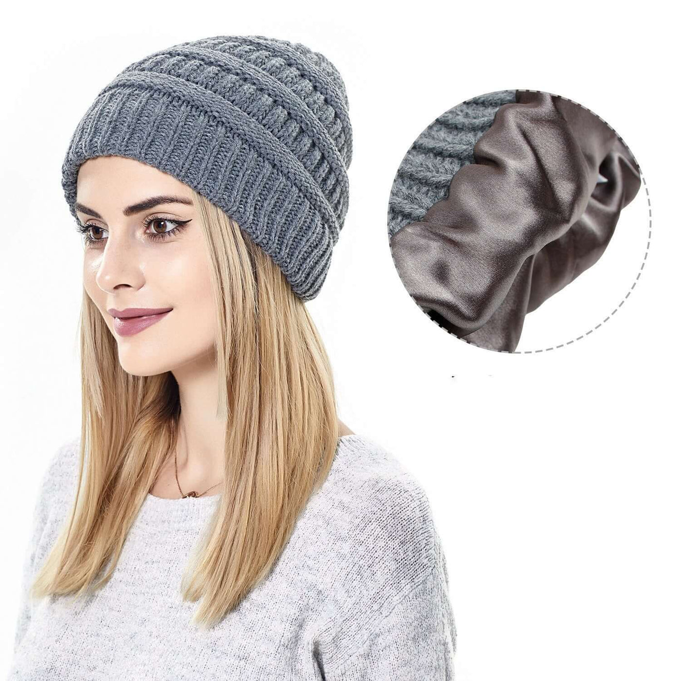 Stylish woman wearing a warm gray knitted hat with satin lining by BONEHEAD PRO-CREATIONS, perfect for winter.