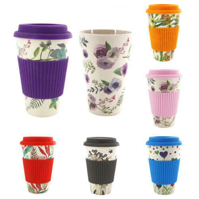 Variety of colorful reusable water cups made from bamboo fiber, featuring floral designs and silicone covers.