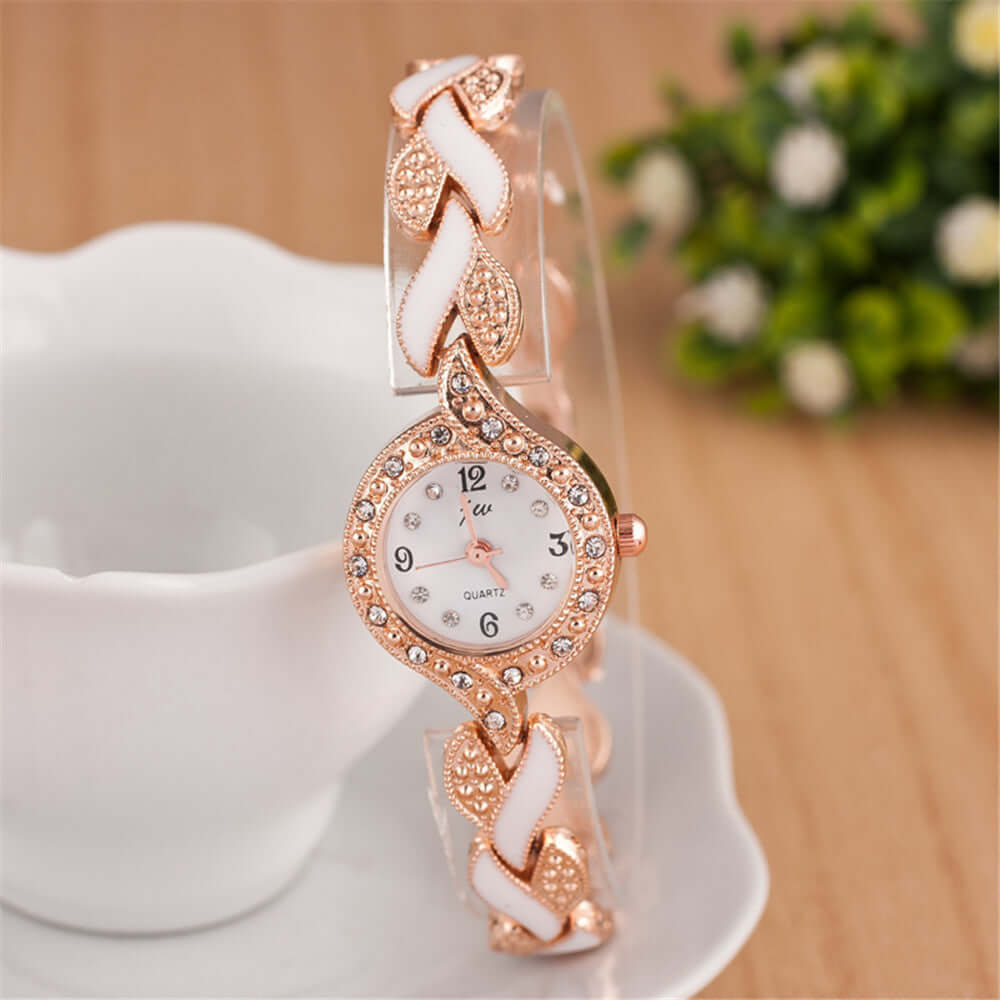 Trendy quartz watch with leaf design bracelet and rose gold accents, elegant decorative accessory by BONEHEAD PRO-CREATIONS.