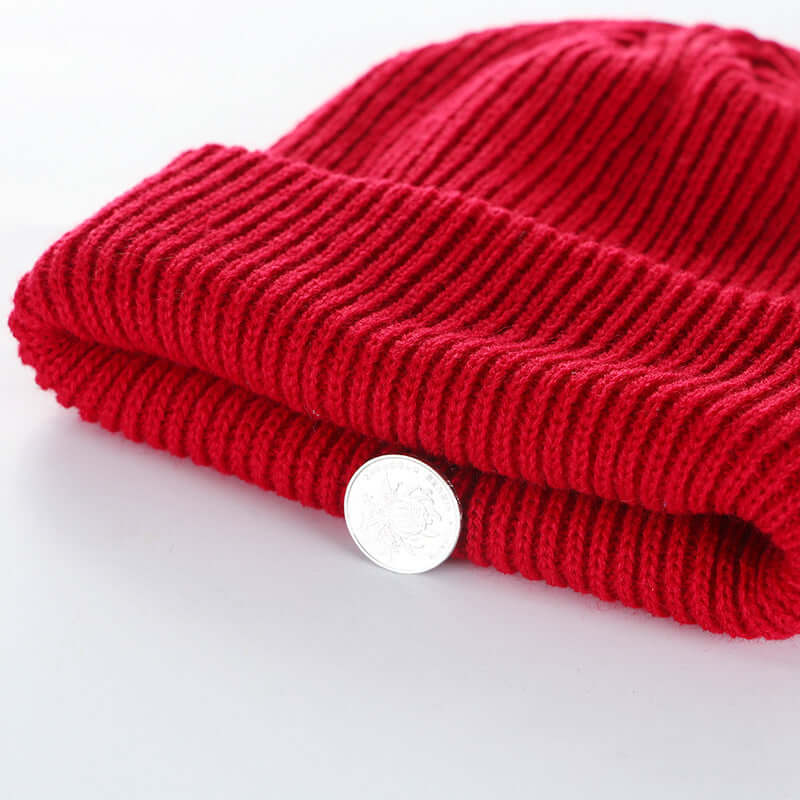 Red knit cap by Bonehead Pro-Creations, showcasing warmth and style for men's and women's curling fashion.