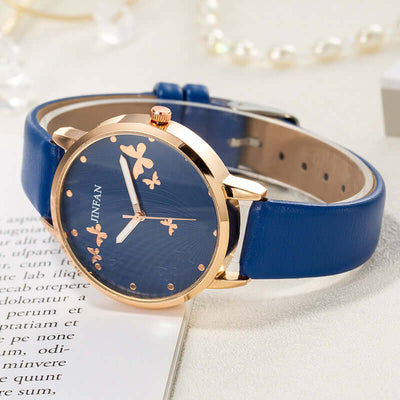 Casual student butterfly wrist watch by BONEHEAD PRO-CREATIONS with blue imitation leather strap and elegant floral design.