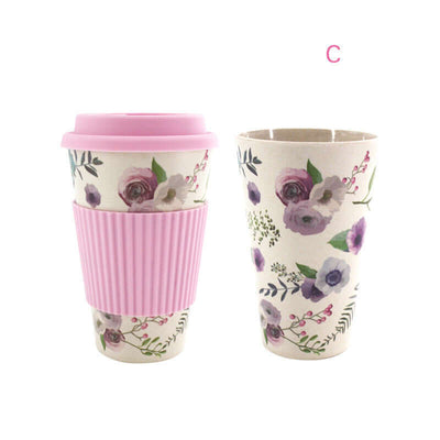 Stylish bamboo fiber water cup with floral design and pink silicone lid for eco-friendly drinking.
