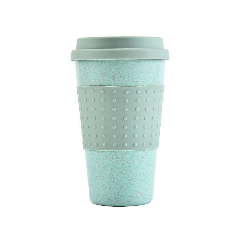 Eco-friendly wheat straw water cup with silicone lid in light green, perfect for beverages on-the-go.