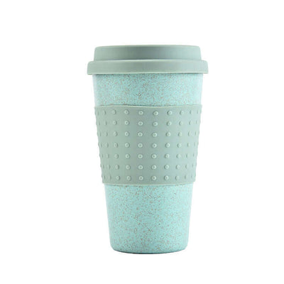 Eco-friendly wheat straw water cup with silicone lid in light green, perfect for beverages on-the-go.