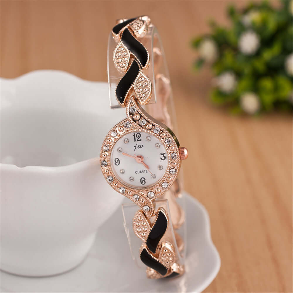 Trendy quartz wrist watch with decorative rose gold and black strap, ideal for fashion-forward individuals.
