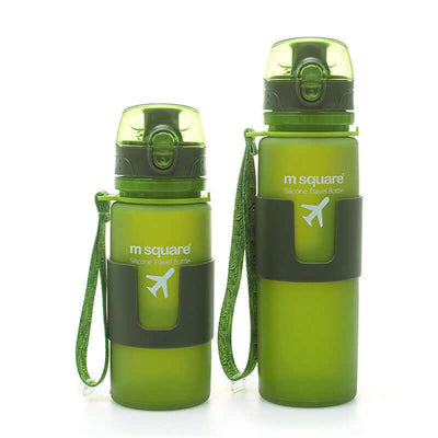 Portable green silicone travel bottles for hydration, ideal for outdoor adventures and active lifestyles.