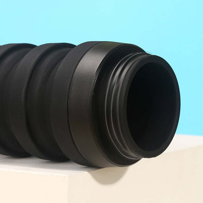 Close-up of a black collapsible water bottle featuring a silicone seal and a textured grip for easy handling.
