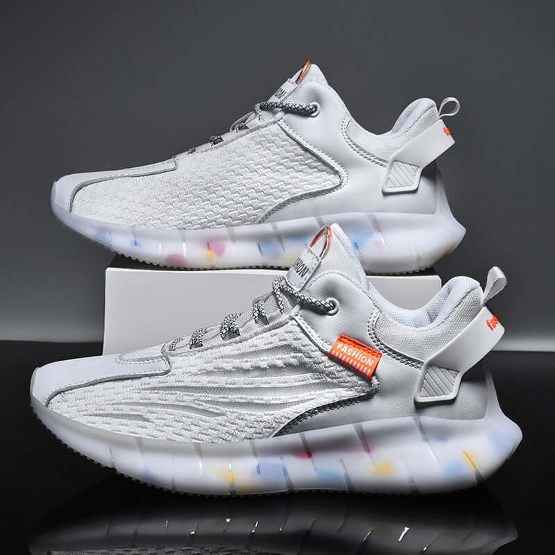 Breathable lightweight white sports shoes by BONEHEAD PRO-CREATIONS featuring net design and colorful sole.