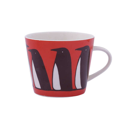 Ceramic coffee mug featuring penguin design on a vibrant red background, perfect for animal lovers.