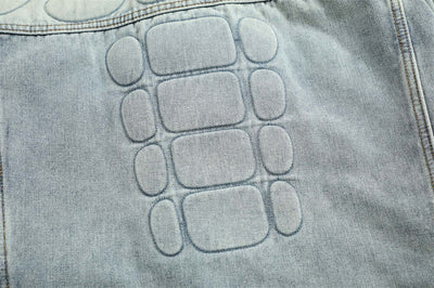 Distressed denim jacket with skull art for men