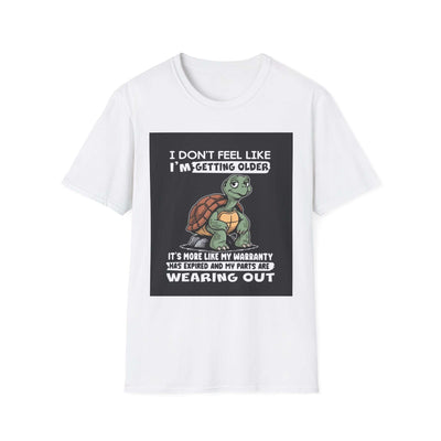 White t-shirt with humorous turtle graphic and text about aging and warranties.