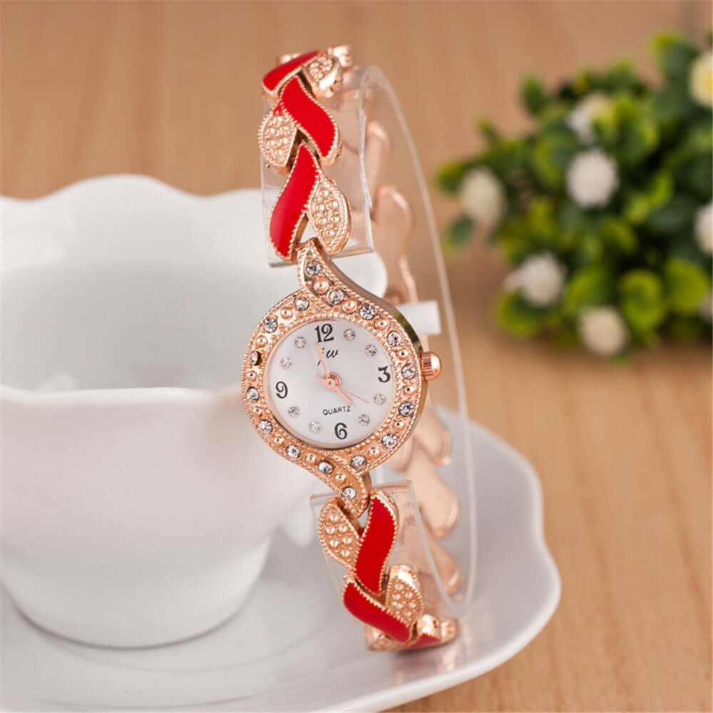 Trendy Leaf Bracelet Quartz Wrist Watch with red accents and shiny details from BONEHEAD PRO-CREATIONS.