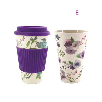 Decorative bamboo fiber water cup with purple silicone lid and sleeve, showcasing floral design and modern simplicity.