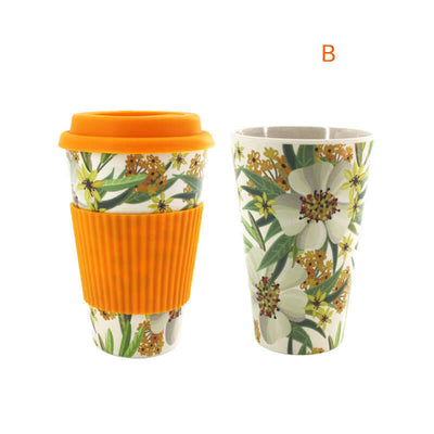 Colorful floral bamboo fiber water cups with orange silicone lids, showcasing modern simplicity and eco-friendly materials.