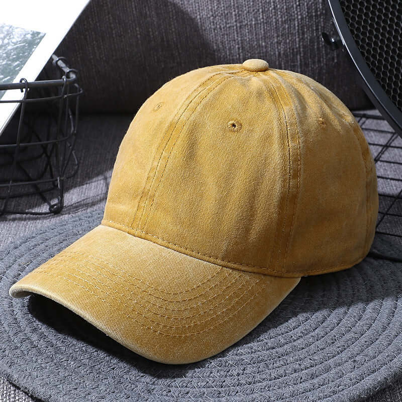 Washed yellow baseball cap for men and women, distressed sun hat from BONEHEAD PRO-CREATIONS, curved style.