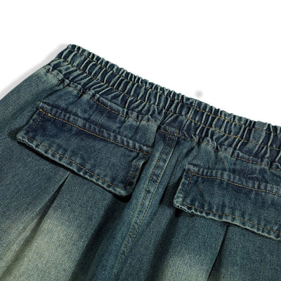 Close-up of the waistband and back pockets of men's fashion denim trousers in blue.