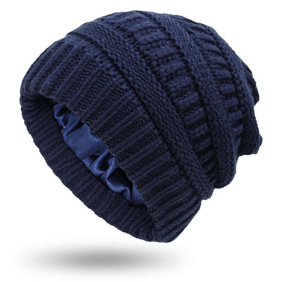Navy knitted women's hat with satin lining, perfect for protective hairstyles in chilly weather by BONEHEAD PRO-CREATIONS.