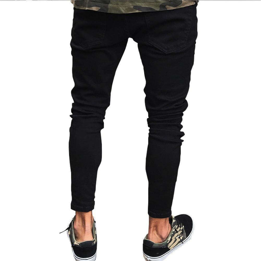Men's black pencil jeans with high elasticity, showcasing a casual look with stylish sneakers.