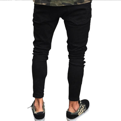 Men's black pencil jeans with high elasticity, showcasing a casual look with stylish sneakers.