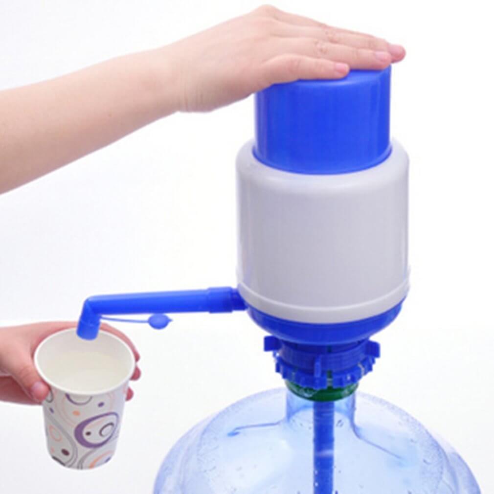 Water hand pump for bottled drinking water with blue and white design, dispensing water into a cup.