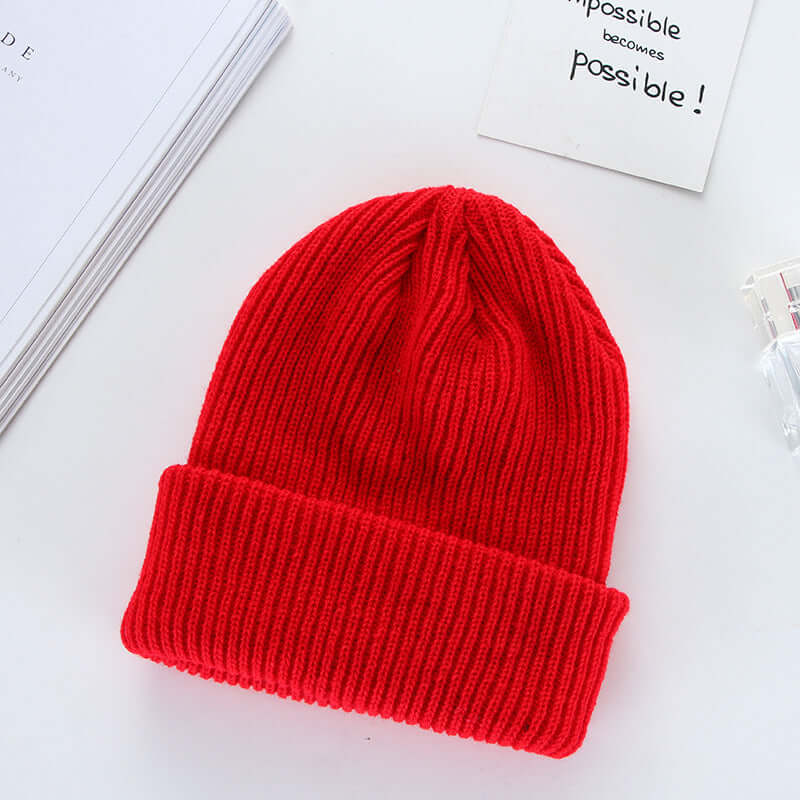 Stylish red knit cap made from wool, perfect for curling enthusiasts. BONEHEAD PRO-CREATIONS fashion hat.